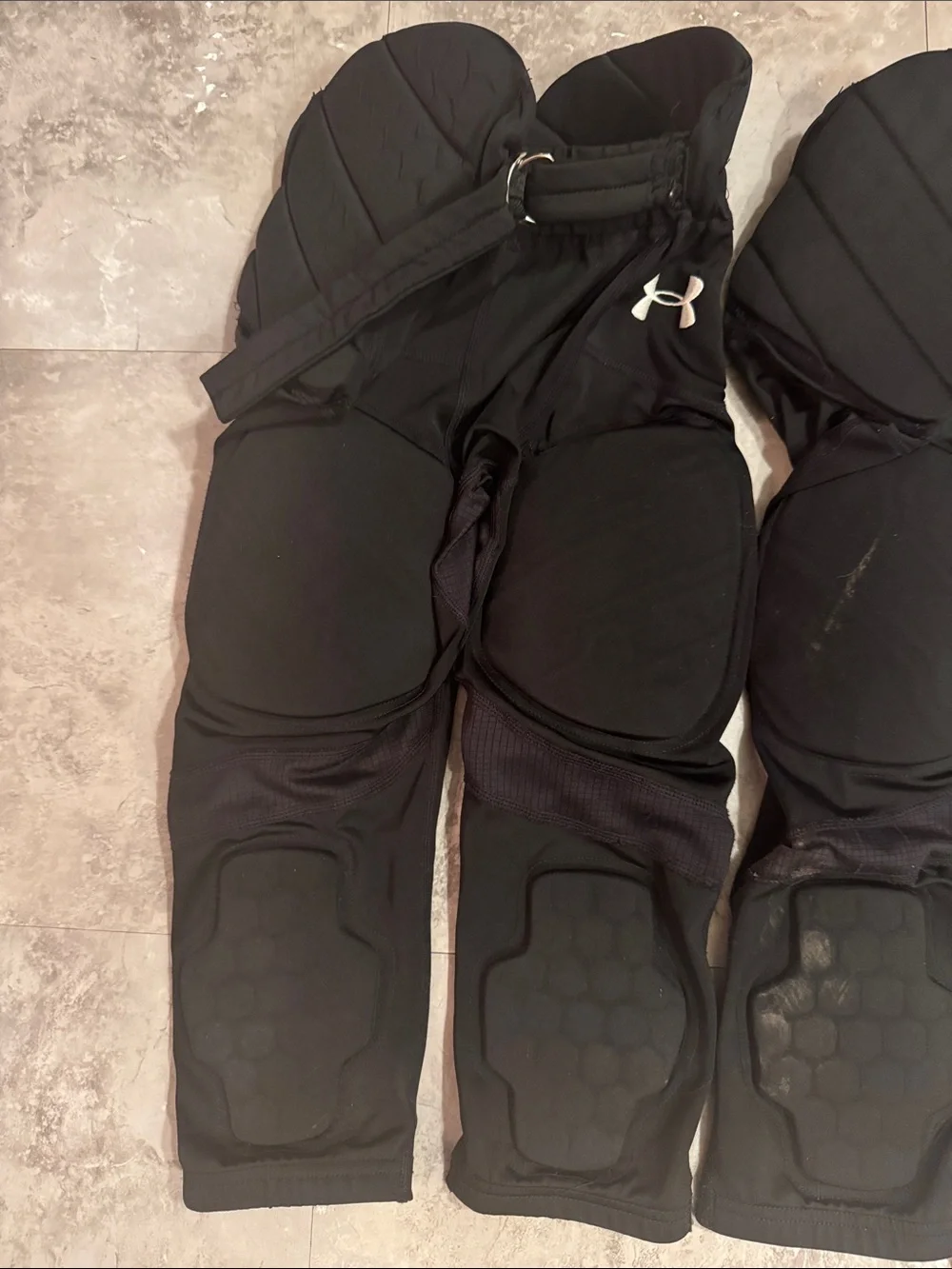 Under Armour youth, small padded, black football pants